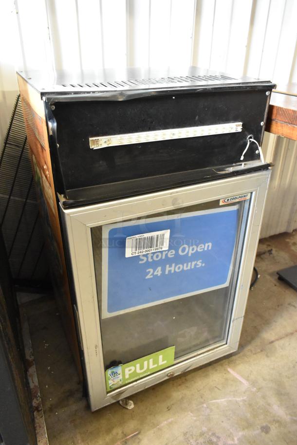 Metal Mini Cooler Merchandiser, Coolpoint brand, 115 Volts, 1 Phase. Features glass door, LED lights, and "Store Open 24 Hours" sign.