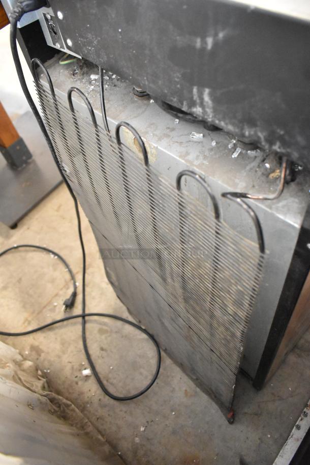 Metal Mini Cooler Merchandiser, 115V, 1 Phase. Visible wear and electrical cord attached.