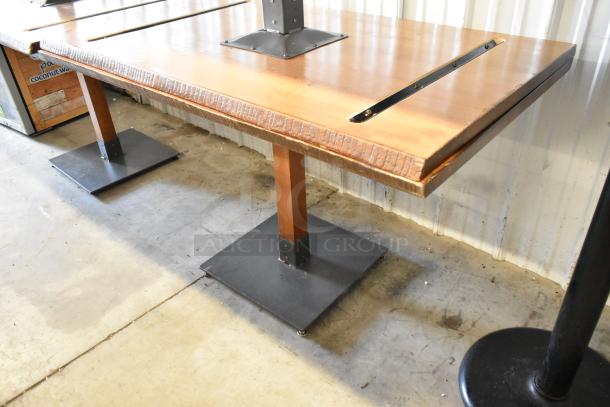 6 wooden dining height tables with metal bases, featuring rustic edges and slots, in good condition.
