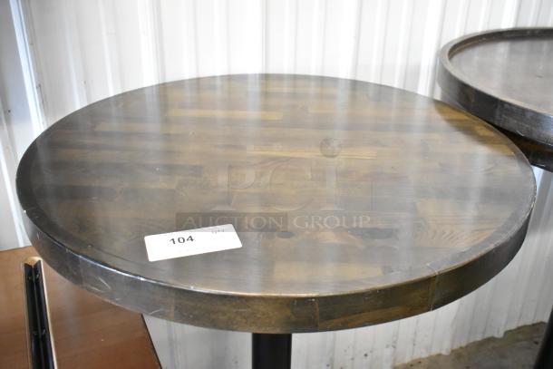 5 wooden round bar height tables in good condition, dark finish, visible label with number 104.