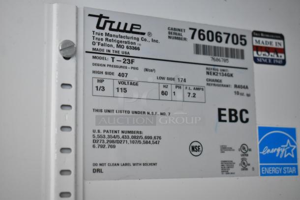 True T-23F stainless steel commercial freezer label showing model details, voltage, and energy efficiency ratings.