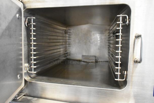 Cleveland 24CGM200 stainless steel convection steam cabinet interior, 200,000 BTU, commercial-grade, natural gas-powered.