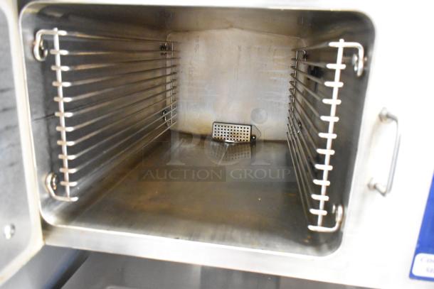 Cleveland 24CGM200 stainless steel convection steam cabinet, natural gas, 2 deck, 200,000 BTU, interior view, clean condition.