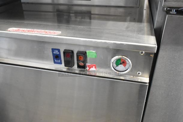 Cleveland 24CGM200 stainless steel 2-deck convection steam cabinet, 200,000 BTU, control panel with gauges and switches visible.