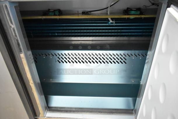 Yukon YUC-72F stainless steel 3-door undercounter freezer, commercial casters, 115 volts, 1 phase, interior view.