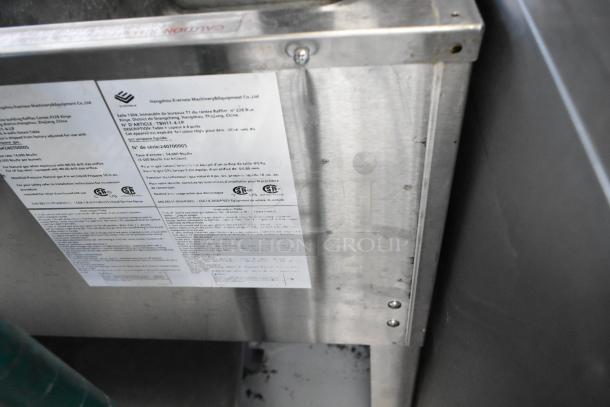 Stainless steel commercial gas-powered 4 burner steam table with under shelf. Manufacturer's label visible. Good condition.