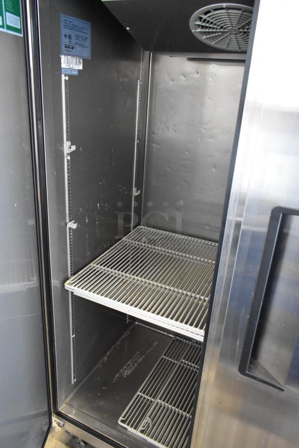 Turbo Air M3F47-2 stainless steel 2-door freezer with poly-coated racks, commercial casters, 115V, 1 phase, clean interior.