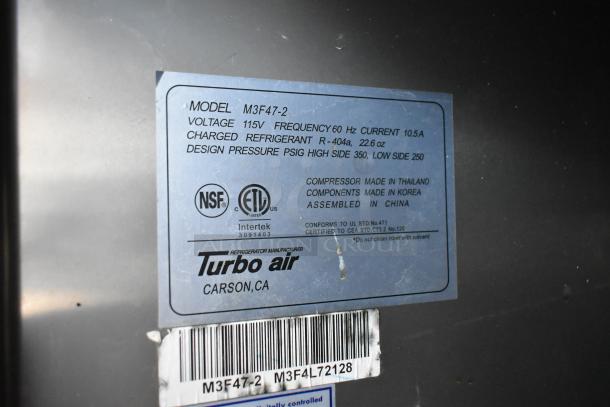Turbo Air M3F47-2 stainless steel 2-door reach-in freezer. Features poly-coated racks, commercial casters. 115V, 1-phase.