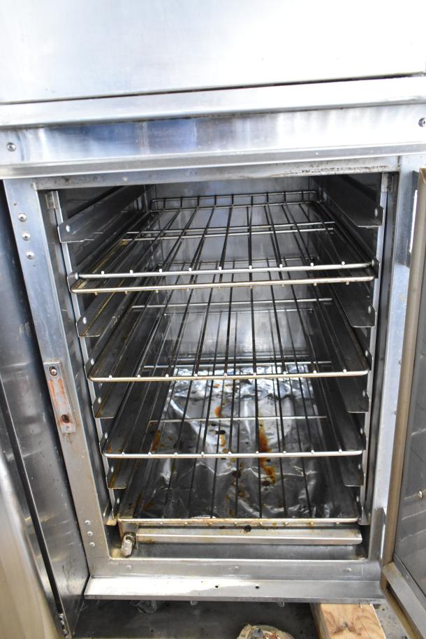 CresCor 1000CHSS2DE heated holding cabinet, stainless steel, 2 half-size doors, top door won't open, on casters.
