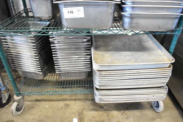 Two-tier metal cart with stacked metal baking pans and stainless steel drop-in bins and lids. Slightly used condition. Label indicates lot 116.