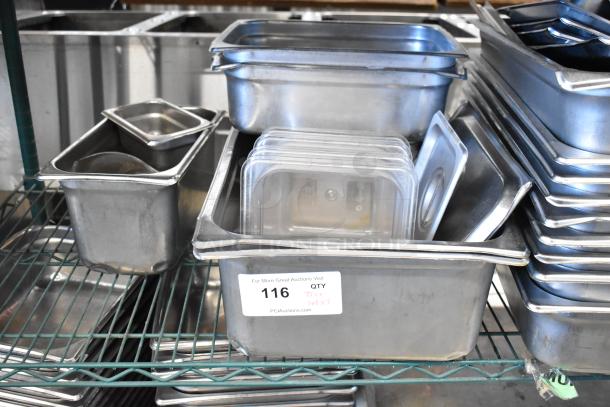 Two-tier lot of metal baking pans, stainless steel drop-in bins, and lids. Includes labels with auction details.