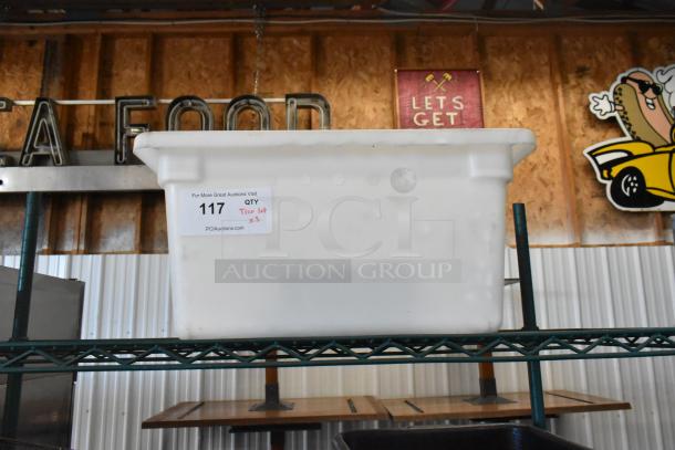 Three-tier lot with a white poly bus bin on a shelf. Auction label reads "117, Tier lot x3, PCIAuctions.com".