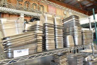 Lot of stainless steel and poly drop-in bins, metal baking pans stacked on shelves. Includes auction tag “120”.