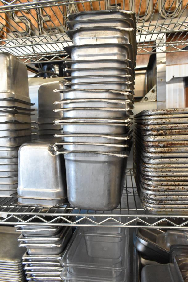 Tiered lot with stainless steel and poly drop-in bins and metal baking pans on wire rack, lightly used.
