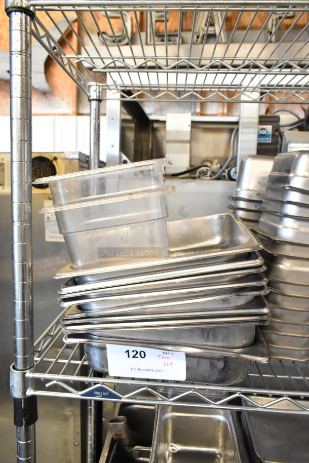Tiered lot of stainless steel bins, metal baking pans, and poly bins on a wire rack, labeled "120" for auction.