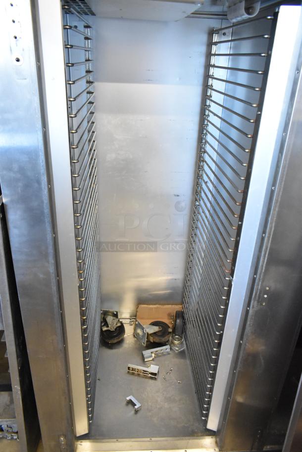 Traulsen AD232W-ZAB27 2 Door Cooler Freezer interior, stainless steel, doors detached, includes shelves and hardware.