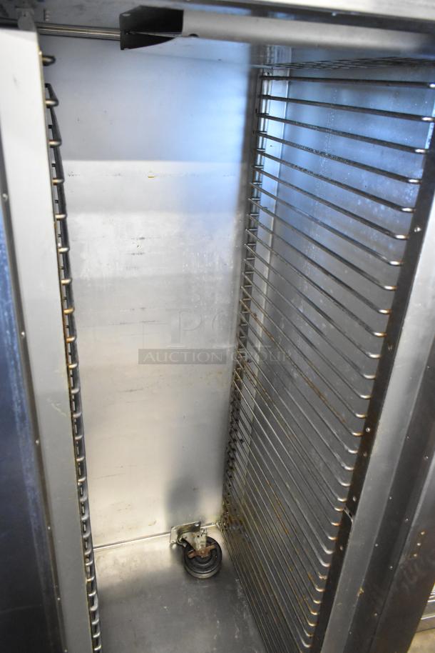 Traulsen AD232W-ZAB27 stainless steel cooler/freezer interior. Racks visible. Doors need attaching. 115V, 1 phase.