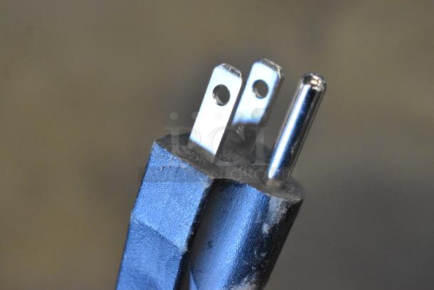 Close-up of a power plug for the KoolMore CDCU-3C-SS refrigerator display case, 115 volts, 1 phase.