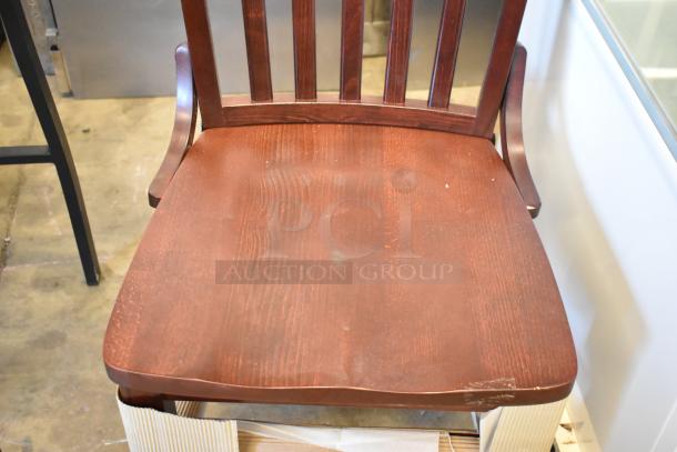3 brand new chairs; 2 black metal bar height with wooden slats, 1 wooden dining height. Minor scratches, great value.