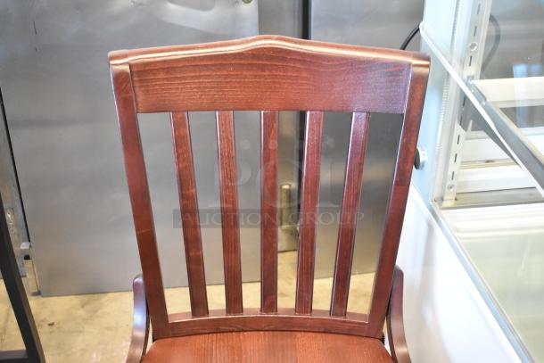 3 brand new chairs: 2 black metal bar height with wooden slats, 1 wooden dining height. Scratch and dent condition.