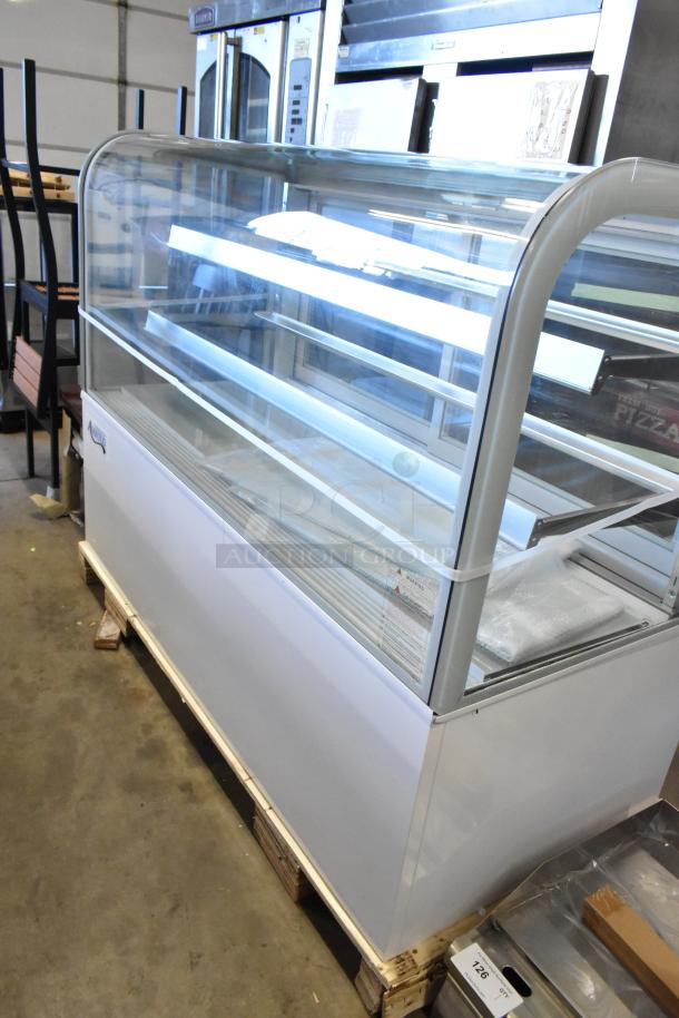 Brand new Avantco 193BC60HCW 60" curved glass refrigerated bakery display case in white, slight scratches and dents, 115 volts.