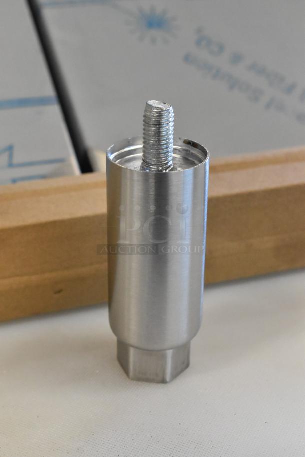 Stainless steel bolt, partially threaded, shown upright, with wood and cardboard in the background.