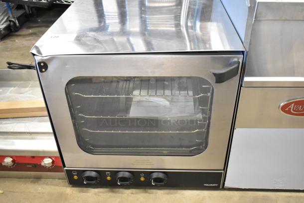 Brand new Vollrath COV-208240-HS stainless steel countertop convection oven with minor dents. 208-240V, 1 Phase.