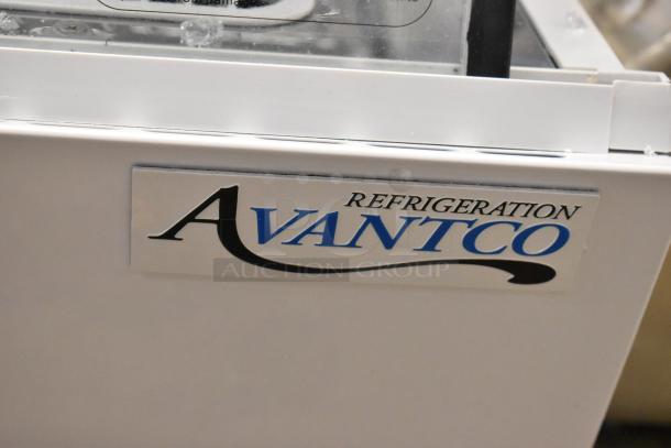 Alt Text:  
Avantco 360BCC60HCW refrigerated countertop bakery display case, white, showing logo. Note: glass damage present.