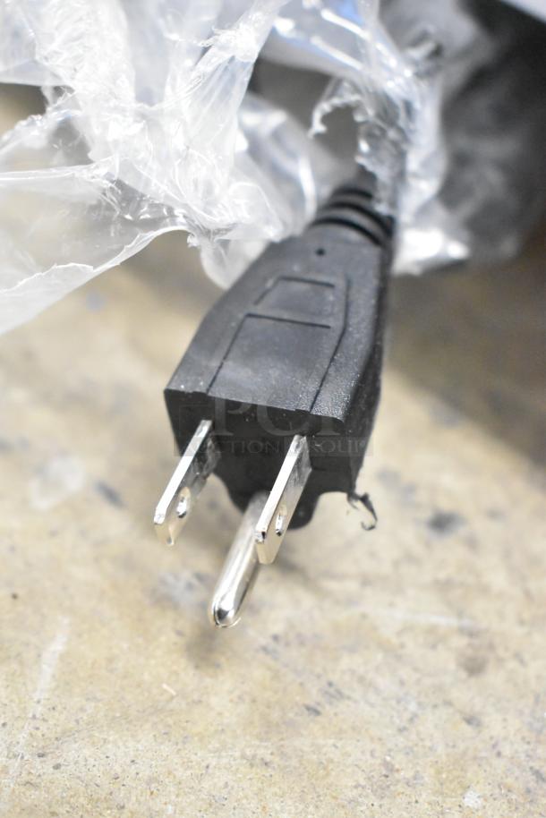 Black power plug for Avantco 360BCC60HCW refrigerated bakery display case, wrapped in plastic.