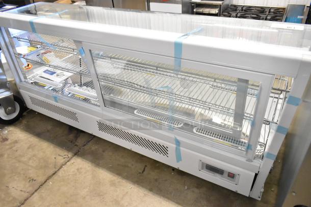 Avantco 360BCC60HCW 60" white refrigerated countertop bakery display case with LED lighting. New with glass damage.