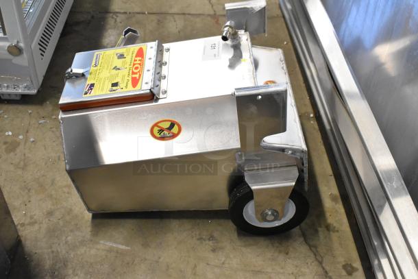 Brand new Shortening Shuttle SS-914W waste oil container, 95 lb. capacity, with pump and warning labels. Slight dent visible.