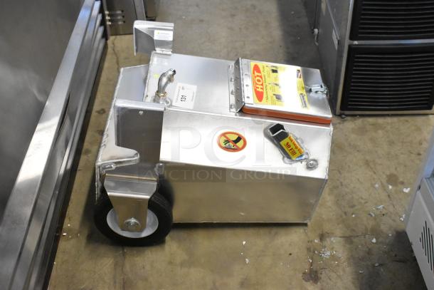 Brand new Shortening Shuttle SS-914W waste oil transport container, 95 lb. capacity, with pump. Slight scratches.