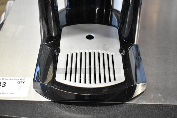 2025 Fetco Luxus LGD-20 coffee dispenser, 2-gallon capacity, stainless steel, new with minor scratches, includes stand.