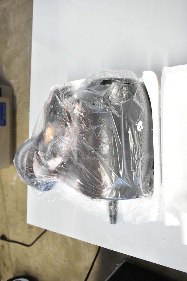 Brand new Schumacher SE-2352-CA Battery Charger, in plastic wrap, labeled as scratch and dent.