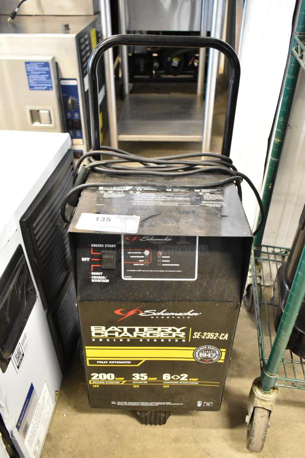 Brand new Schumacher SE-2352-CA battery charger, scratch and dent, 200A engine start, 12V, labeled as fully automatic.