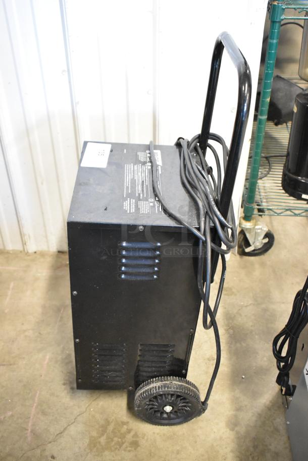 BRAND NEW SCRATCH AND DENT Schumacher SE-2352-CA Battery Charger. Black, portable, minor cosmetic wear, tags intact.