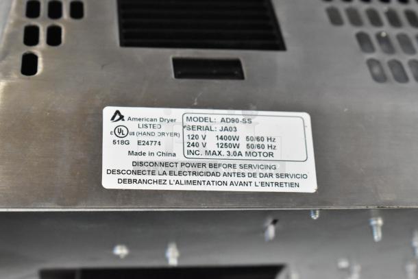 American Dryer Advantage AD90-SS stainless steel hand dryer, new condition, voltage details and maintenance warning label visible.