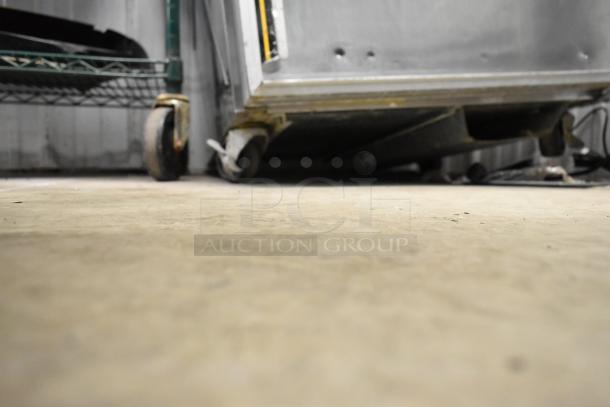Silver King SKF27 stainless steel undercounter freezer with visible wheels. Commercial-grade, 115 volts, 1 phase.