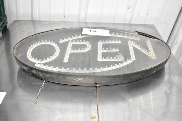 Oval light-up "Open" sign with LED bulbs, in used condition, featuring a hanging chain.
