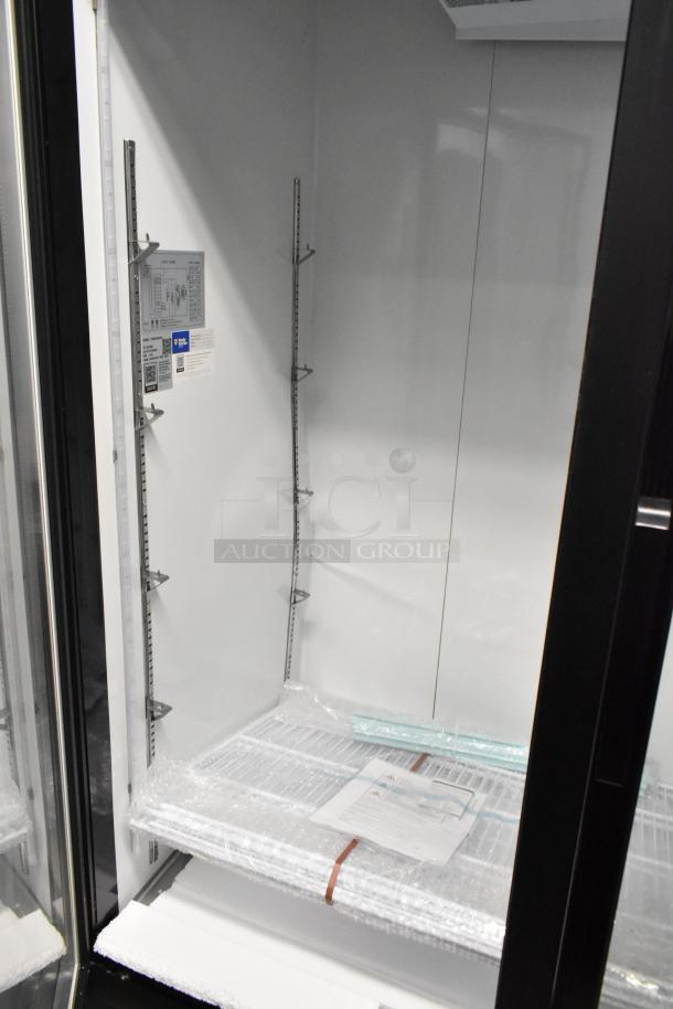 Brand new Avantco 178GDC49HCB 53" black swing glass door merchandiser refrigerator with LED lighting, customizable interior, 115V.