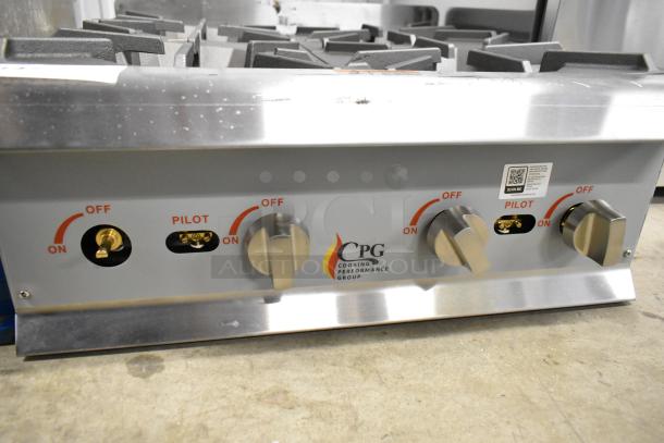 BRAND NEW Cooking Performance Group R-CPG-24-NL stainless steel 4-burner natural gas range, 88,000 BTU, slight cosmetic dents.