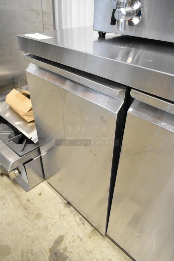 BRAND NEW 2025 Avantco 178SSUC36FHC stainless steel 36" 2-door undercounter freezer with visible scratches.