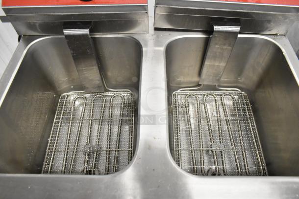 Brand new Avantco 177F202 electric fryer, dual tank, 30 lb. capacity, metal baskets, and lids; 208-240V, 1-phase.