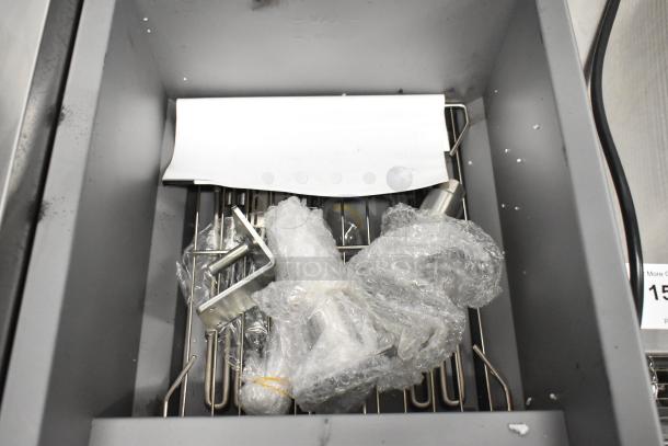 Brand new Avantco 177EF40D stainless steel commercial fryer, minor scratches, includes two metal fry baskets, 240V.
