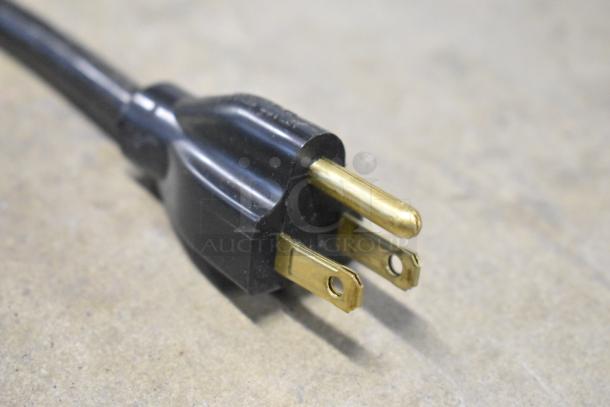 A black electrical plug with three metal prongs, part of a Vollrath JT1 Conveyor Toaster. New condition with voltage of 120.
