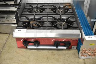 Brand new Avantco 177CAGR424 stainless steel 4-burner gas range, 100,000 BTU; scratch and dent condition, model 2025.