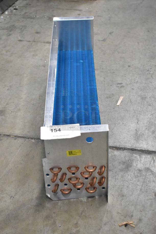 Brand new SDKH 5R7K745L evaporator coil with visible blue fins and metal frame, slight dents; auction tag reads "154".
