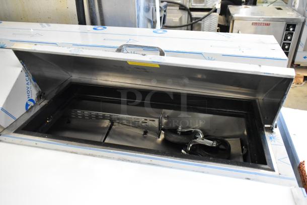 Brand new Avantco 447APST72 72" 3-door stainless steel sandwich prep table with minor dents, 115V, 1 phase, open top view.