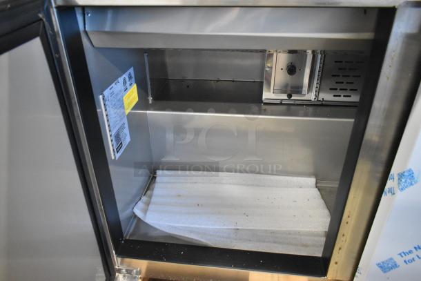 Brand new Avantco 447APST72 stainless steel 72" 3-door refrigerated prep table, showing interior shelf. Potential minor dents. 