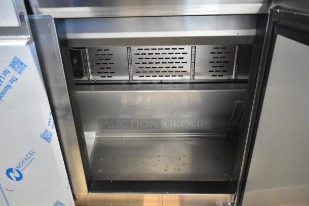 Brand new 2025 Avantco 447APST72, 72" 3-door stainless steel refrigerated prep table, 115V, 1 phase, interior view.